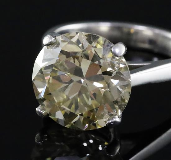 A 9ct white gold and solitaire diamond ring, the transitional cut stone weighing 7.06cts, size N.